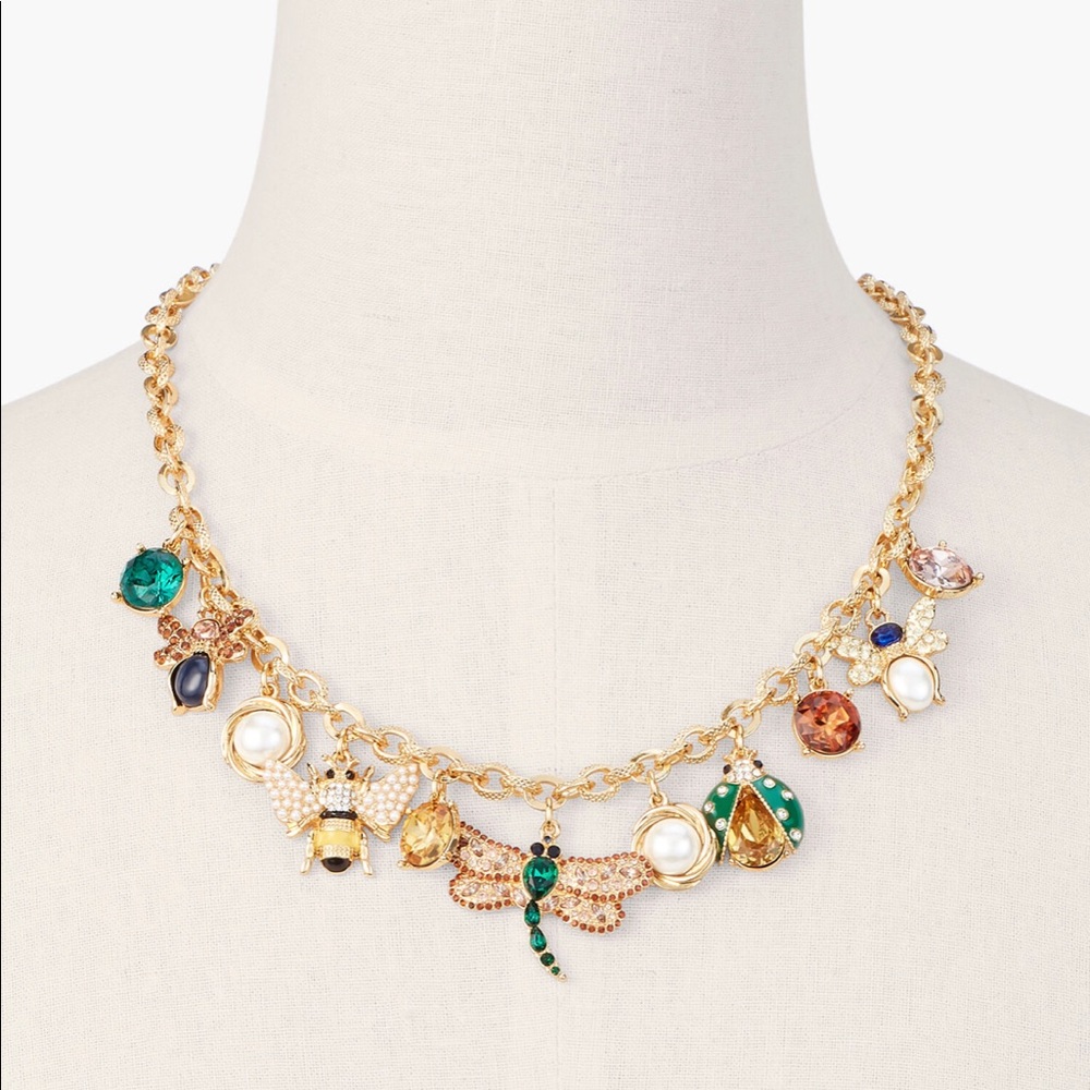 A whimsical charm necklace that evokes the beauty of a blooming garden